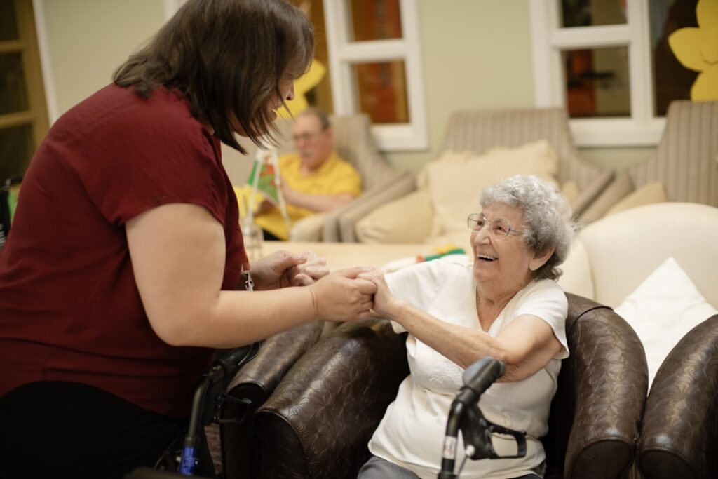 Smiling senior woman at home with a caregiver in Burlington Ontario