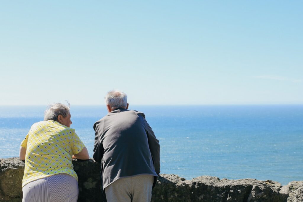 Family caregiver couple taking a peaceful break outdoors — respite care Ontario